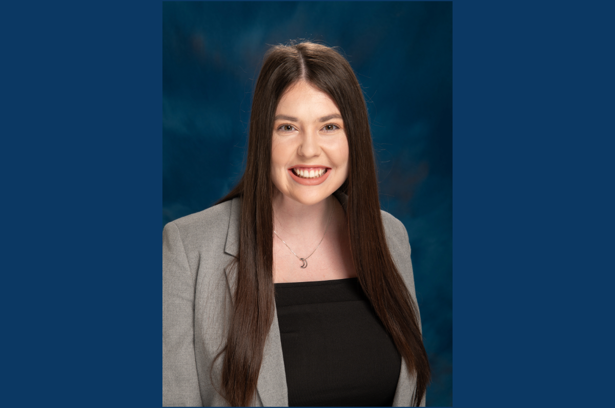 Portrait of young woman with long, dark, straight hair